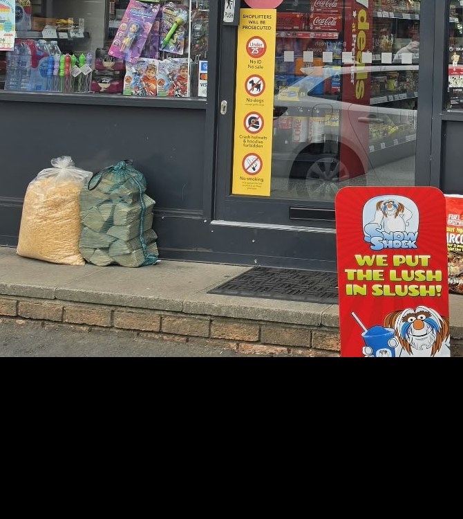 The Post Office services list in the Clapham shop window: business banking, personal banking, travel money, travel insurance, bill payment, drop and go, collect and return, letters and parcels